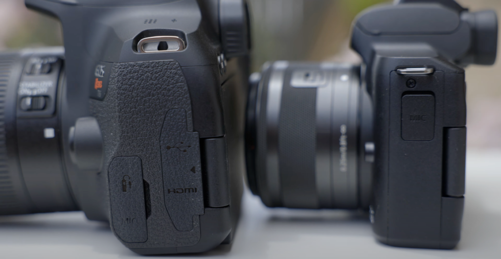 A photograph of two black cameras showing their side sections.