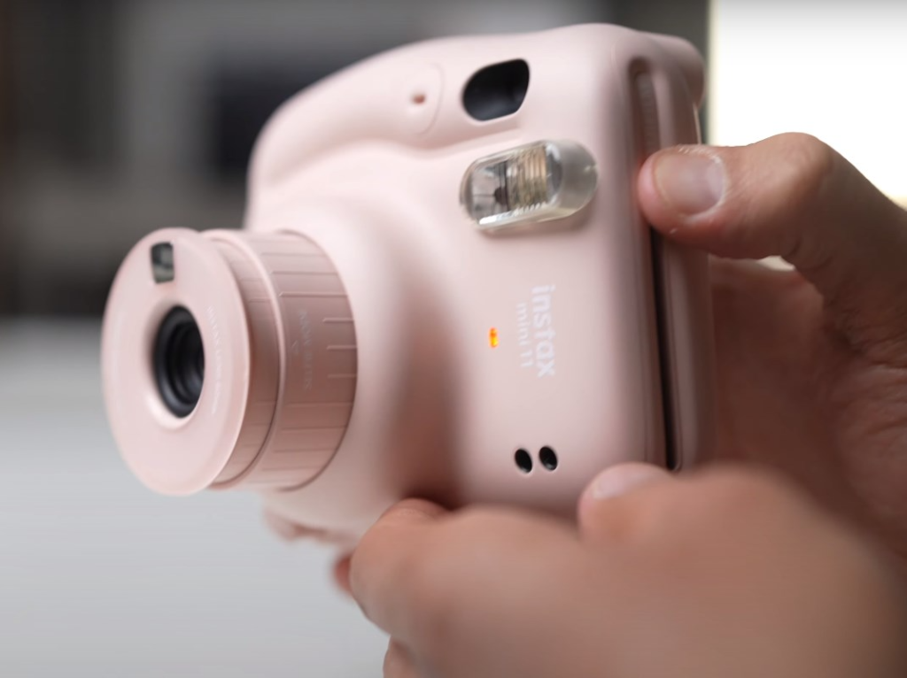 the front of the Instax Mini 11 camera representing the flash lampface