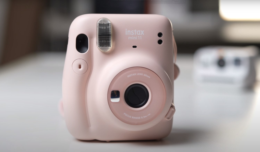 the front of Fujifilm’s Instax Mini 11 camera in pink color