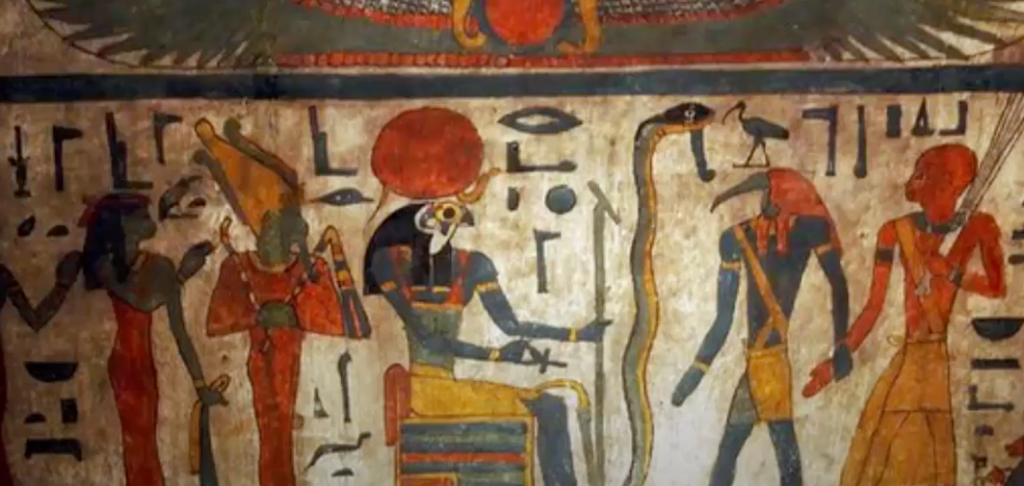 Photograph depicting Egyptian wall paintings with human figures, snakes, and ancient inscriptions